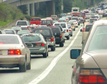 How can I encourage my staff not to bring their cars to work?